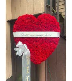 Red Carnations Memorial Heart. An arrangement by Violeta's Flower Shop.