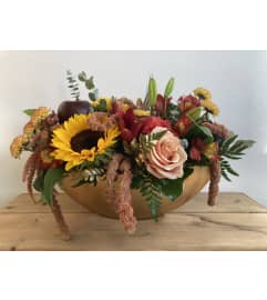 Harvest Warmth Centerpiece. An arrangement by Mayfield Flowers.