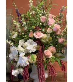Blushing Orchid Elegance. An arrangement by Plaza Florist and Gifts.