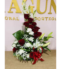 Pureza y Amor. An arrangement by Maguni Floral Boutique and Gift Shop.