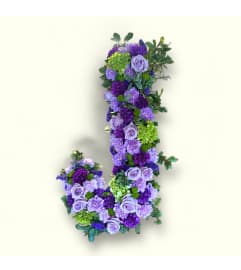 Custom Letter Spray. An arrangement by Vanessa's Flower Shop.