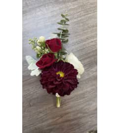Burgundy Bliss Boutonniere. An arrangement by Floral Lady Design Studio LLC.