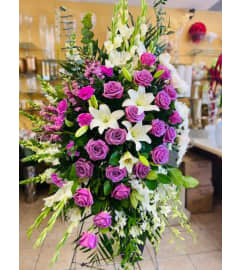 Purple and White Spray. An arrangement by Jennifer's Flowers and Gifts.