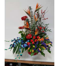 Blue Orchids With Birds. An arrangement by Jennifer's Flowers and Gifts.