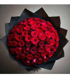 100 Wrapped Red Roses Bouquet. An arrangement by Flowers by Girlfriends.