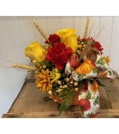Thankful Pumpkin. An arrangement by Flowers By Gerry.