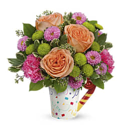 Teleflora's Time To Celebrate Bouquet. An arrangement by Love Floral.