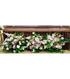 Casket Flower Bed. An arrangement by Blumenladen Tampa Flower Shop.