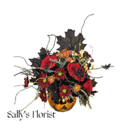 Sally's Halloween in vase. An arrangement by Tim's Florist and Garden.