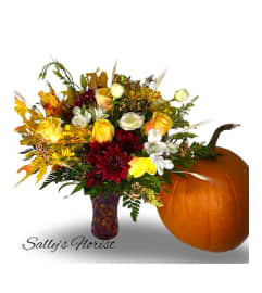 Sally Fall Specials with pumpkin. An arrangement by Prime Florist.