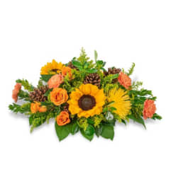 Prosperous Centerpiece. An arrangement by The Flower Shop of Lake Charles.