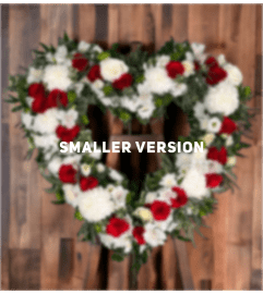 Elegant Blooms of Comfort Heart Wreath. An arrangement by Brooklin Floral and Garden Shoppe Inc..