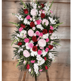 Warm Remembrance Standing Spray. An arrangement by Brooklin Floral and Garden Shoppe Inc..