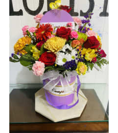 Cheerful Blooms Harmony. An arrangement by Geni's Florist and Gifts.