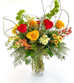 Fiery Evergreen. An arrangement by Marianna's Flower Island.