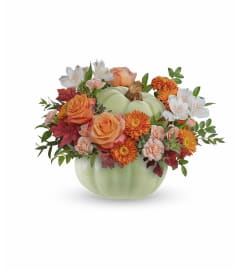 Whimsy Pumpkin (Teleflora). An arrangement by North Liberty Flower Shop.