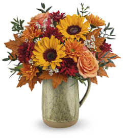 Harvest Season Bouquet (Teleflora). An arrangement by North Liberty Flower Shop.