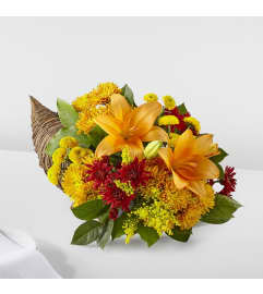 Bouquet of Blessings Cornucopia (FTD). An arrangement by North Liberty Flower Shop.