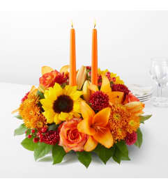 FTD Grateful Centerpiece. An arrangement by North Liberty Flower Shop.