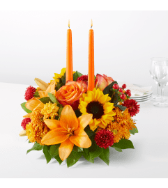 FTD Grateful Centerpiece. An arrangement by North Liberty Flower Shop.