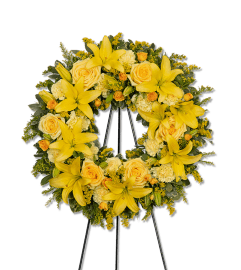 Radiant Remembrance Wreath. An arrangement by The Flower Shop of Lake Charles.