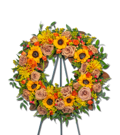 Sunset Serenade Wreath. An arrangement by The Flower Shop of Lake Charles.