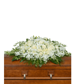 Pure Serenity Grande Casket Spray. An arrangement by The Flower Shop of Lake Charles.