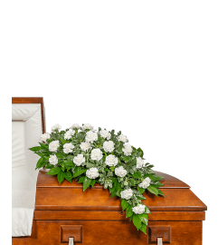 Wings of Peace Casket Spray. An arrangement by The Flower Shop of Lake Charles.