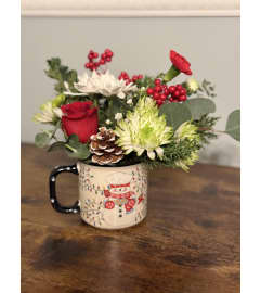 Holiday Cheer Mug Bouquet. An arrangement by Kelly Ann's Floral.