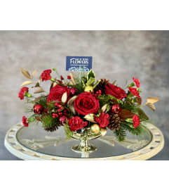 A Holly Jolly Centrepiece. An arrangement by Say It With Flowers.