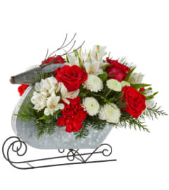 FTD Reindeer Sleigh Arrangement. An arrangement by Floral Fantasy.