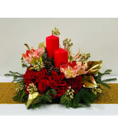 Christmas Glow Centerpiece. An arrangement by Dream Decorations Florist.