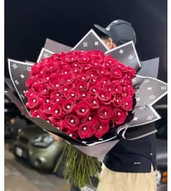100 reasons. An arrangement by Illusion Flower Shop.