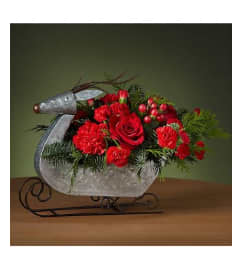 FTD Reindeer Sleigh. An arrangement by The Butterfly Florist.