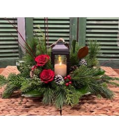 All is Bright Christmas/Winter Lantern Arrangement. An arrangement by Forest Florist.