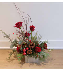 Rustic Christmas Centerpiece. An arrangement by Canmore Flowers by Alpine Blooms.