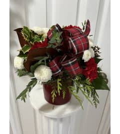 Winter Holly Jolly. An arrangement by Linda's Floral Designs.