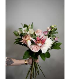 Designer's choice Hand-tied bouquet: Soft. An arrangement by Enchanted Florist.