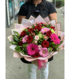 Premium Long-stemmed Red Rose Bouquet. An arrangement by The Flower Shop in the Village.