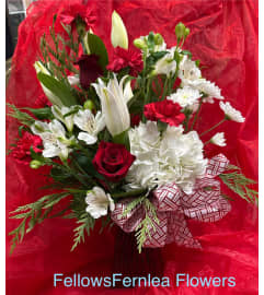 Christmas Vase. An arrangement by Fellows Fernlea Flowers.