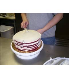 Red velvet Smith Island Cake - Personal Size. An arrangement by Flowers n Things.
