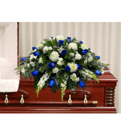 Faith Casket Spray. An arrangement by DMP Flowers and Gifts.