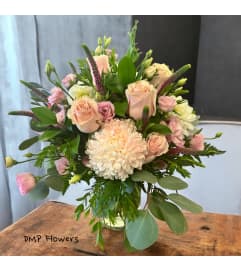 Blushing blooms. An arrangement by DMP Flowers and Gifts.