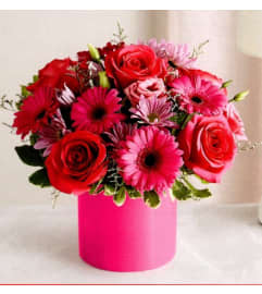 Fun and Flirty. An arrangement by Julie's Artistic Rose.