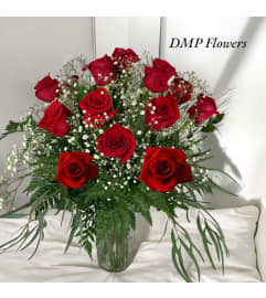 12 classic long stem roses. An arrangement by DMP Flowers and Gifts.