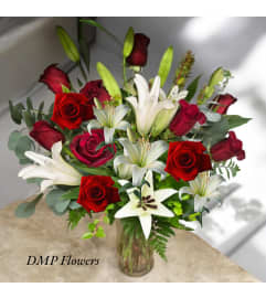 Red rose and lily. An arrangement by DMP Flowers and Gifts.