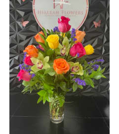 Vibrant Sunset Bliss. An arrangement by Hialeah Flowers.