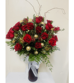 Roses with chocolate. An arrangement by Dream Decorations Florist.