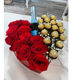 Rose Heart Box With Mini Bottle and Chocolate. An arrangement by Margaret's Florist.