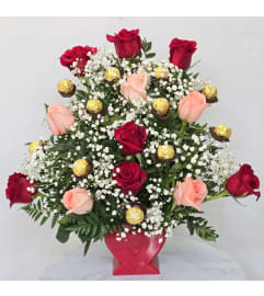 Blush Of Love chocolats. An arrangement by Rosebud Studio Florist.